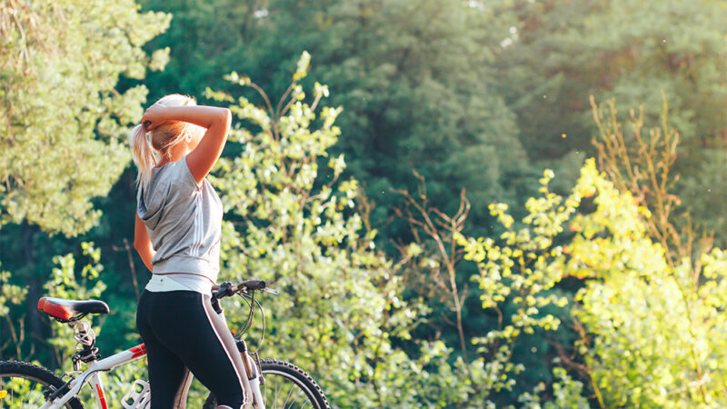 Lady with bike in nature